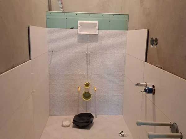 Precision tile cuts and layout around an outlet