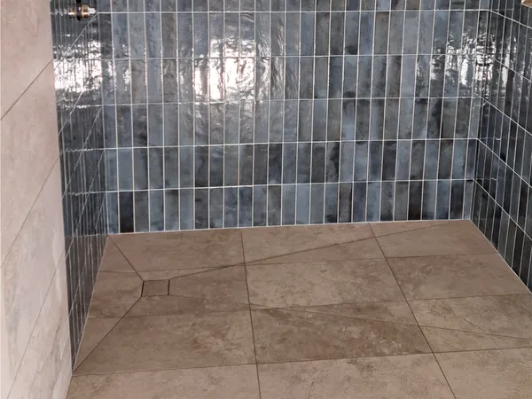 Epoxy grout being worked in and cleaned off