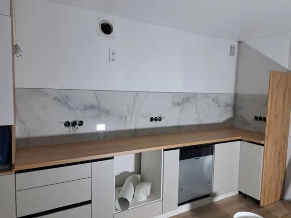 Kitchen backsplash by VitalTile & Stone — Large-format marble-look porcelain · epoxy grout