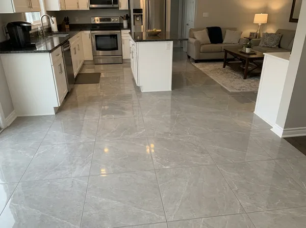 Main floor retile by VitalTile & Stone — Full demo of original flooring · new porcelain