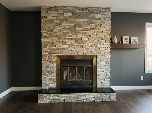 Stone fireplace surround by VitalTile & Stone — Natural stone · floor to ceiling feature wall